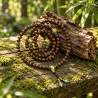 108-Bead Wood Mala with Gold Guru Bead - 05_scene_outdoor_agarwood
