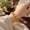 Citrine bracelet worn while reading